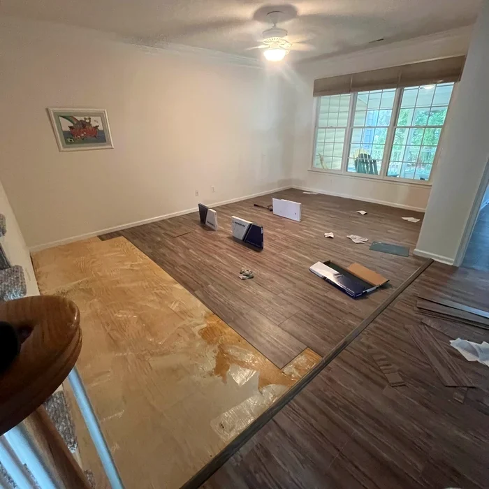 Flooring installation progress before AJ Builders LLC finished the room