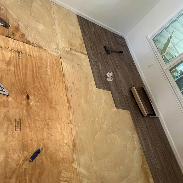 Flooring being installed across room